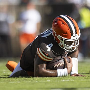 Oct 20, 2024; Cleveland, Ohio, USA; Cleveland Browns quarterback Deshaun Watson (4) falls to the ground with a torn Achilles during the second quarter against the Cincinnati Bengals at Huntington Bank Field. Mandatory Credit: Scott Galvin-Imagn Images