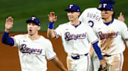 Texas Rangers left fielder Wyatt Langford (36) and Texas Rangers center fielder Michael Helman (24) celebrate with teammates after the game against the Milwaukee Brewers at Globe Life Field. 