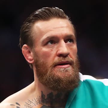 January 18, 2020; Las Vegas, Nevada, USA; Conor McGregor holds an Irish flag as he celebrates his first round TKO victory against Donald Cerrone following UFC 246 at T-Mobile Arena. Mandatory Credit: Mark J. Rebilas-Imagn Images
