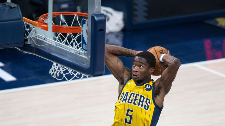 Apr 24, 2021; Indianapolis, Indiana, USA; Indiana Pacers guard Edmond Sumner (5) tamahawk dunks the basketball in the first quarter against the Detroit Pistons at Bankers Life Fieldhouse. Mandatory Credit: Trevor Ruszkowski-USA TODAY Sports