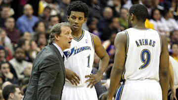 December 14, 2010; Washington, DC, USA; Washington Wizards head coach Flip Saunders (left) talks to shooting guard Nick Young (1) and point guard Gilbert Arenas (9) against the Los Angeles Lakers at Verizon Center. Mandatory Credit: Geoff Burke-Imagn Images