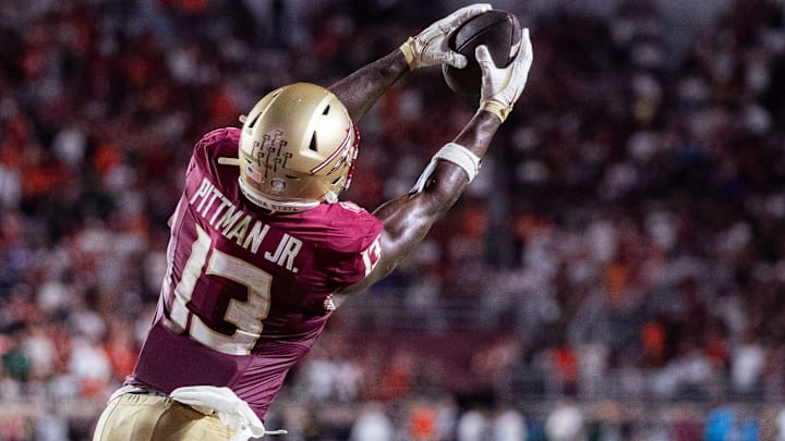 Florida State Seminoles tight end Randy Pittman Jr. (13) leaps in the air to catch a pass. The Miami Hurricanes defeated the Florida State Seminoles 22-28 at Doak Campbell Stadium on Saturday, Oct. 4, 2025.