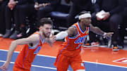 Dec 10, 2025; Oklahoma City, Oklahoma, USA; Oklahoma City Thunder guard Shai Gilgeous-Alexander (2) and center Chet Holmgren (7) celebrate after scoring against the Phoenix Suns during the third quarter at Paycom Center. Mandatory Credit: Alonzo Adams-Imagn Images