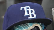 Sep 26, 2025; Toronto, Ontario, CAN; The hat and glove of Tampa Bay Rays third baseman Junior Caminero (13) in the dugout during the game against the Toronto Blue Jays at Rogers Centre. 