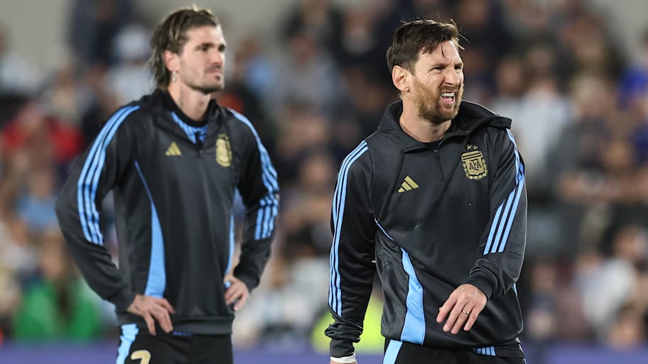 Rodrigo de Paul (left) and Lionel Messi.