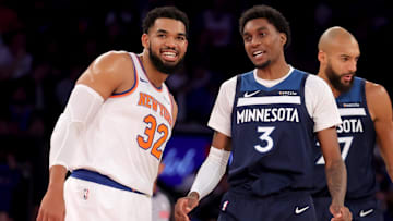 Nov 5, 2025; New York, New York, USA; Minnesota Timberwolves forward Jaden McDaniels (3) talks to New York Knicks center Karl-Anthony Towns (32) during the first quarter at Madison Square Garden.