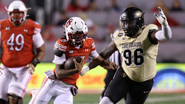 Oct 25, 2025; Salt Lake City, Utah, USA; Utah Utes quarterback Byrd Ficklin (15) runs against Colorado Buffaloes defensive lineman Jehiem Oatis (96) during the second quarter at Rice-Eccles Stadium. Mandatory Credit: Rob Gray-Imagn Images