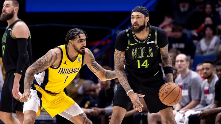 Mar 1, 2024; New Orleans, Louisiana, USA;  Indiana Pacers forward Obi Toppin (1) defends against New Orleans Pelicans forward Brandon Ingram (14) during the first half at Smoothie King Center. Mandatory Credit: Stephen Lew-USA TODAY Sports