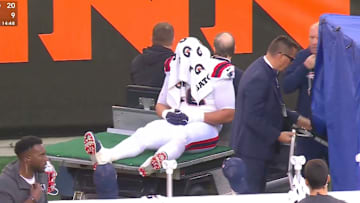 Patriots offensive tackle Will Campbell was carted off the field.
