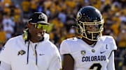 Oct 7, 2023; Tempe, Arizona, USA; Colorado Buffaloes head coach Deion Sanders with son and quarterback Shedeur Sanders (2) against the Arizona State Sun Devils at Mountain America Stadium.