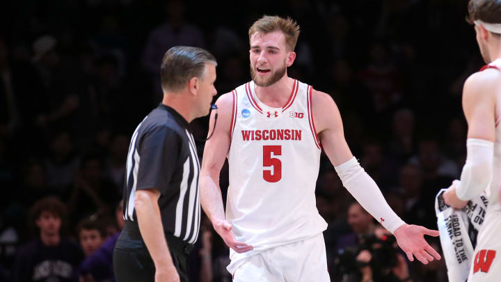 Mar 22, 2024; Brooklyn, NY, USA; Wisconsin Badgers forward Tyler Wahl (5) reacts to the referee against the James Madison Dukes in the first round of the 2024 NCAA Tournament at the Barclays Center. Mandatory Credit: Brad Penner-USA TODAY Sports