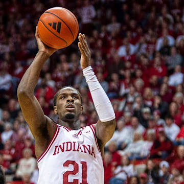 Indiana's Mackenzie Mgbako (21) scores overt Maryland's Derik Queen (25) during the Indiana versus Maryland men's basketball game at Simon Skjodt Assembly Hall on Sunday, Jan. 26, 2025.