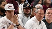 Former NFL quarterback Johnny Manziel sits court side during the game between the Texas A&M Aggies and the Auburn Tigers