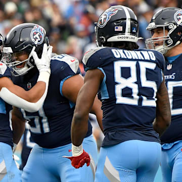 Tennessee Titans running back Tony Pollard celebrates his touchdown with offensive tackle John Ojukwu. Mandatory Credit: Steve Roberts-Imagn Images