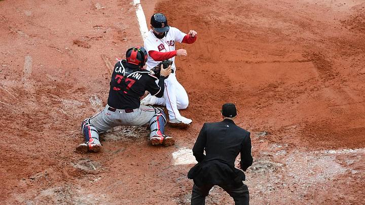 May 24, 2026; Boston, Massachusetts, USA;  Minnesota Twins catcher Victor Caratini (37) tags out Boston Red Sox pinch runner Connor Wong (12) during the ninth inning at Fenway Park. Mandatory Credit: Bob DeChiara-Imagn Images
