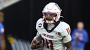 Oct 25, 2025; Pittsburgh, Pennsylvania, USA;  North Carolina State Wolfpack quarterback CJ Bailey (11) runs the ball against the Pittsburgh Panthers during the third quarter at Acrisure Stadium. Mandatory Credit: Charles LeClaire-Imagn Images