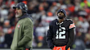 Cleveland Browns quarterback Shedeur Sanders (12) waits for his opportunity as head coach Kevin Stefanski watches Dillon Gabriel lead the offense during the first half of an NFL football game at Huntington Bank Field, Nov. 16, 2025, in Cleveland, Ohio.