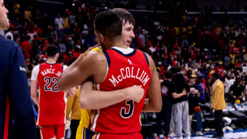 Apr 16, 2024; New Orleans, Louisiana, USA; New Orleans Pelicans guard CJ McCollum (3) hugs Los Angeles Lakers guard Austin Reaves (15) after the play-in game of the 2024 NBA playoffs  at Smoothie King Center. Mandatory Credit: Stephen Lew-USA TODAY Sports
