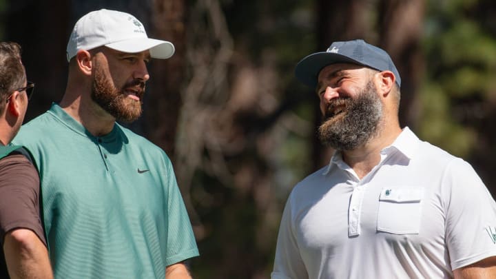 Travis Kelce and brother Jason Kelce talk on the 4th tee during the first round of the American Century Celebrity Championship golf tournament.