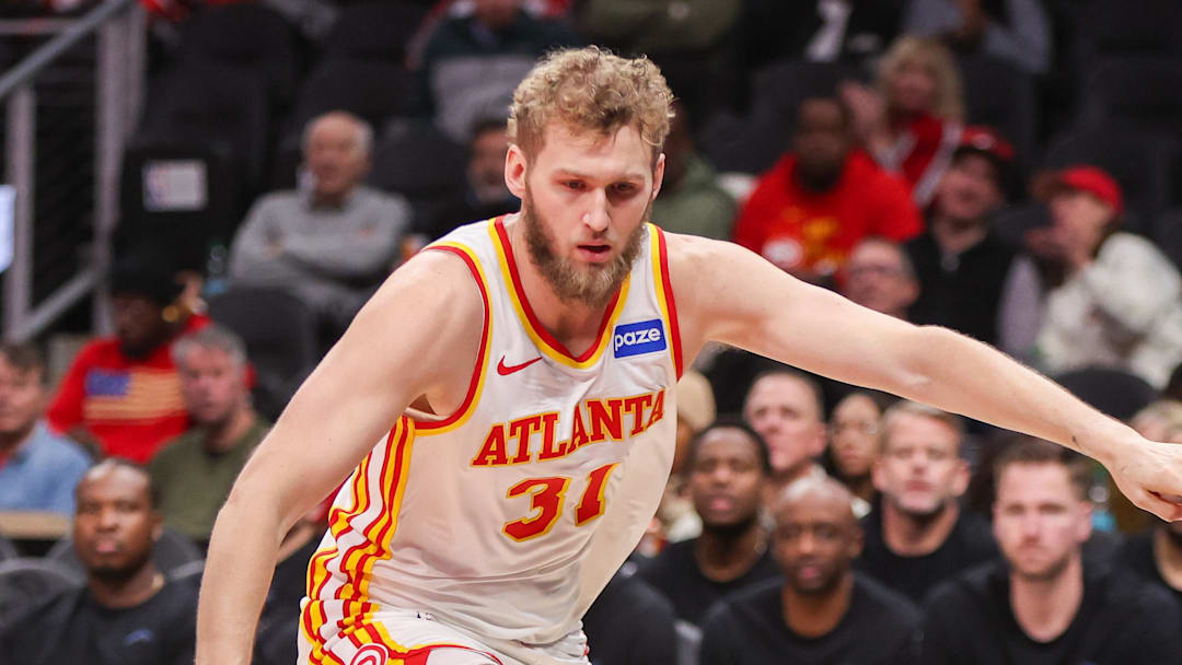 Hawks center Jock Landale (31) reaches for a loose ball against the Utah Jazz in the first quarter at State Farm Arena.