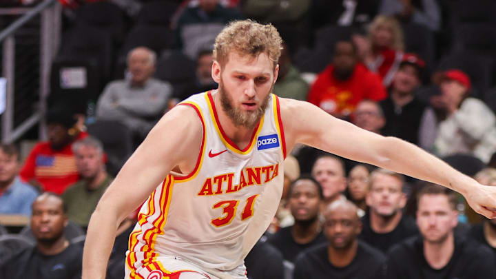 Hawks center Jock Landale (31) reaches for a loose ball against the Utah Jazz in the first quarter at State Farm Arena.
