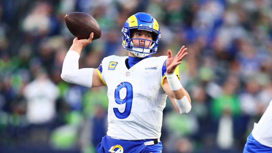 Jan 25, 2026; Seattle, WA, USA; Los Angeles Rams quarterback Matthew Stafford (9) passes against the Seattle Seahawks during the first half in the 2026 NFC Championship Game at Lumen Field. Mandatory Credit: Kevin Ng-Imagn Images