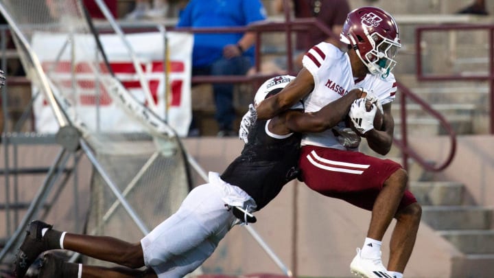 NMSU safety JJ Dervil tackles UMass wide receiver Christian Wells during an Aggie football game on Saturday, August 25, 2023, at the Aggie Memorial Stadium.