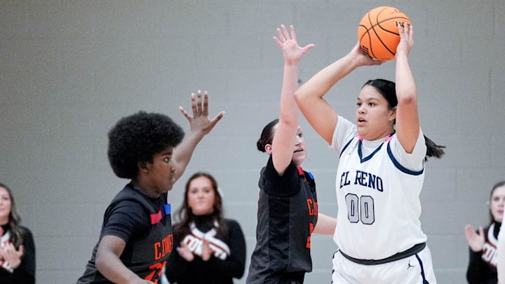 El Reno looks to pass during a 5A OSSAA girls basketball semifinal game between Coweta and El Reno, at Yukon High School in Yukon Okla., on Thursday, March 13, 2025.