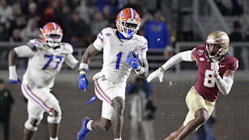 Nov 30, 2024; Tallahassee, Florida, USA; Florida Gators running back Montrell Johnson Jr. (1) runs the ball for a touchdown during the second half against the Florida State Seminoles at Doak S. Campbell Stadium. Mandatory Credit: Melina Myers-Imagn Images