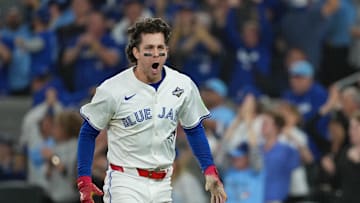 Nov 1, 2025; Toronto, Ontario, CAN; Toronto Blue Jays third baseman Ernie Clement (22) reacts after scoring a run against the Los Angeles Dodgers in the sixth inning for game seven of the 2025 MLB World Series at Rogers Centre. Mandatory Credit: Nick Turchiaro-Imagn Images