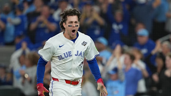 Nov 1, 2025; Toronto, Ontario, CAN; Toronto Blue Jays third baseman Ernie Clement (22) reacts after scoring a run against the Los Angeles Dodgers in the sixth inning for game seven of the 2025 MLB World Series at Rogers Centre. Mandatory Credit: Nick Turchiaro-Imagn Images