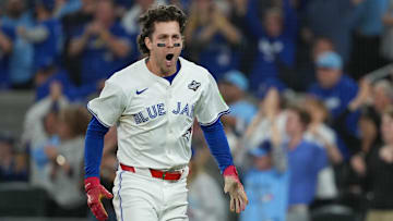 Toronto Blue Jays third baseman Ernie Clement (22) reacts after scoring a run against the Los Angeles Dodgers in the sixth inning for game seven of the 2025 MLB World Series at Rogers Centre. 
