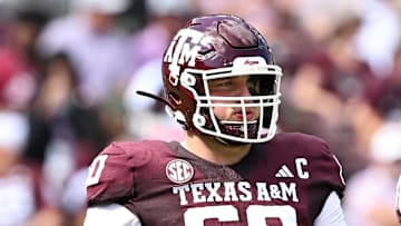 Oct 5, 2024; College Station, Texas, USA; Texas A&M Aggies offensive lineman Trey Zuhn III (60) walks on the field in the first half against the Missouri Tigers at Kyle Field. Mandatory Credit: Maria Lysaker-Imagn Images. 