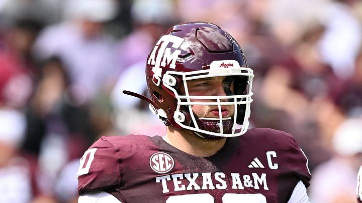 Oct 5, 2024; College Station, Texas, USA; Texas A&M Aggies offensive lineman Trey Zuhn III (60) walks on the field in the first half against the Missouri Tigers at Kyle Field. Mandatory Credit: Maria Lysaker-Imagn Images. 