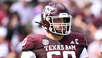 Oct 5, 2024; College Station, Texas, USA; Texas A&M Aggies offensive lineman Trey Zuhn III (60) walks on the field in the first half against the Missouri Tigers at Kyle Field. Mandatory Credit: Maria Lysaker-Imagn Images. 