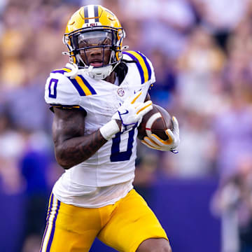 Sep 7, 2024; Baton Rouge, Louisiana, USA; LSU Tigers wide receiver Zavion Thomas (0) runs with the ball against the Nicholls State Colonels during the first half at Tiger Stadium. Mandatory Credit: Stephen Lew-Imagn Images