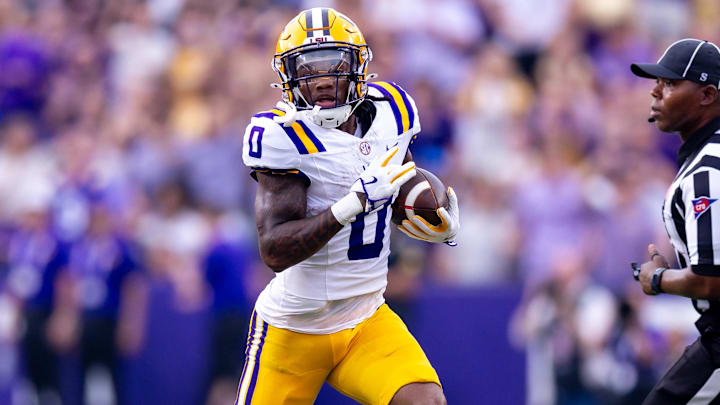 Sep 7, 2024; Baton Rouge, Louisiana, USA; LSU Tigers wide receiver Zavion Thomas (0) runs with the ball against the Nicholls State Colonels during the first half at Tiger Stadium. Mandatory Credit: Stephen Lew-Imagn Images