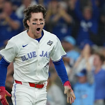 Nov 1, 2025; Toronto, Ontario, CAN; Toronto Blue Jays third baseman Ernie Clement (22) reacts after scoring a run against the Los Angeles Dodgers in the sixth inning for game seven of the 2025 MLB World Series at Rogers Centre. 