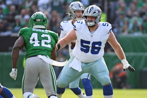 Dallas Cowboys center Cooper Beebe blocks Philadelphia Eagles linebacker Oren Burks at Lincoln Financial Field.