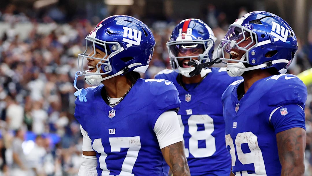 Sep 14, 2025; Arlington, Texas, USA; New York Giants wide receiver Wan'Dale Robinson (17) celebrates after scoring a touchdown against the Dallas Cowboys during the fourth quarter at AT&T Stadium. Mandatory Credit: Kevin Jairaj-Imagn Images