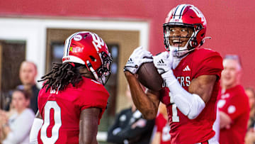 Indiana's Donaven McCulley (1) celebrates his touchdown with Andison Coby (0) during the Indiana football spring game at Memorial Stadaium on Thursday, April 18, 2024.