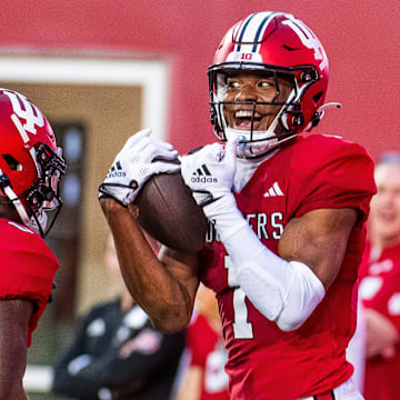 Indiana's Donaven McCulley (1) celebrates his touchdown with Andison Coby (0) during the Indiana football spring game at Memorial Stadaium on Thursday, April 18, 2024.