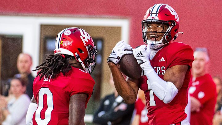 Indiana's Donaven McCulley (1) celebrates his touchdown with Andison Coby (0) during the Indiana football spring game at Memorial Stadaium on Thursday, April 18, 2024.