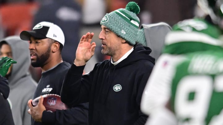Dec 28, 2023; Cleveland, Ohio, USA; New York Jets quarterback Aaron Rodgers (center) gestures before the game between the Cleveland Browns and the Jets at Cleveland Browns Stadium.