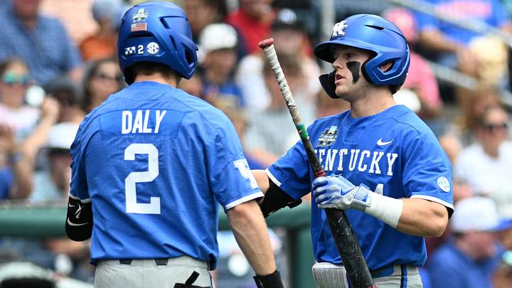 Jun 19, 2024; Omaha, NE, USA;  Kentucky Wildcats second baseman …milien Pitre (4) celebrates a home run with third baseman Mitchell Daly (2) against the Florida Gators during the fifth inning at Charles Schwab Field Omaha. Mandatory Credit: Steven Branscombe-Imagn Images