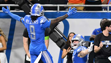Detroit Lions Jameson Williams celebrates with Sam LaPorta