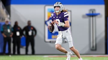 Dec 28, 2023; Orlando, FL, USA;  Kansas State Wildcats quarterback Avery Johnson (2) drops back to pass against the North Carolina State Wolfpack in the first quarter during the Pop-Tarts Bowl at Camping World Stadium. Mandatory Credit: Nathan Ray Seebeck-USA TODAY Sports