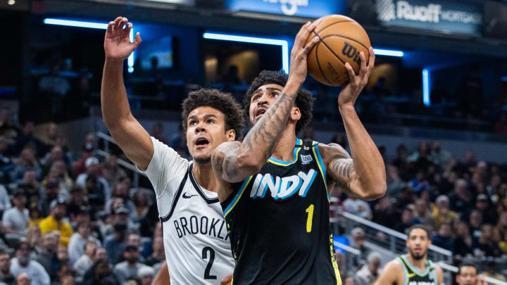 Mar 16, 2024; Indianapolis, Indiana, USA; Indiana Pacers forward Obi Toppin (1) shoots the ball while Brooklyn Nets forward Cameron Johnson (2) defends in the first half at Gainbridge Fieldhouse. Mandatory Credit: Trevor Ruszkowski-USA TODAY Sports