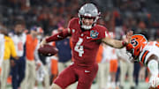 Dec 27, 2024; San Diego, CA, USA; Washington State Cougars quarterback Zevi Eckhaus (4) runs the ball against Syracuse Orange defense during the second half at Snapdragon Stadium. Mandatory Credit: Abe Arredondo-Imagn Images