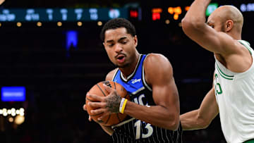 Nov 23, 2025; Boston, Massachusetts, USA;  Orlando Magic guard Jett Howard (13) controls the ball while Boston Celtics guard Derrick White (9) defends during the first half at TD Garden. Mandatory Credit: Bob DeChiara-Imagn Images